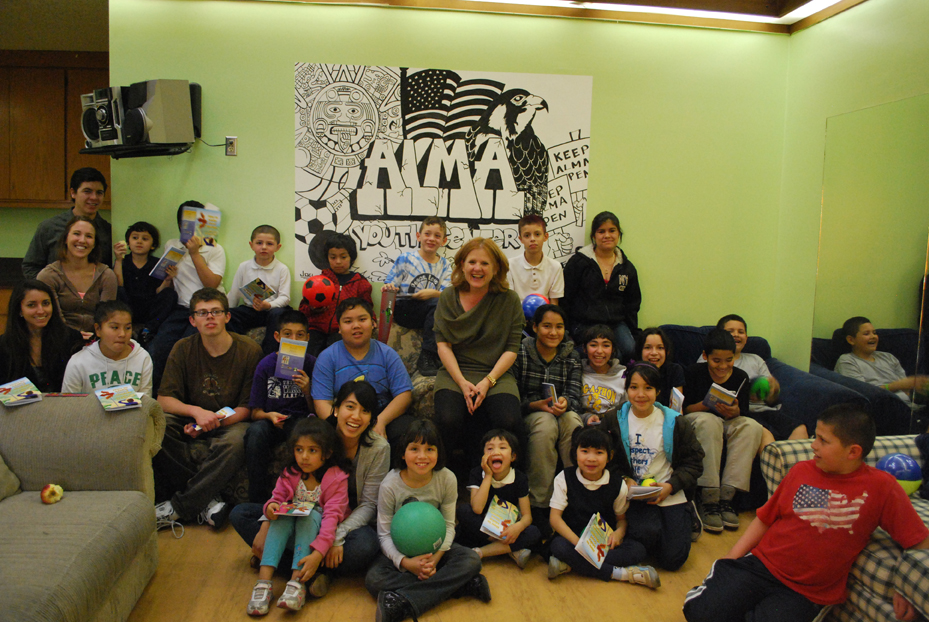 Nancy with kids at the ALMA center