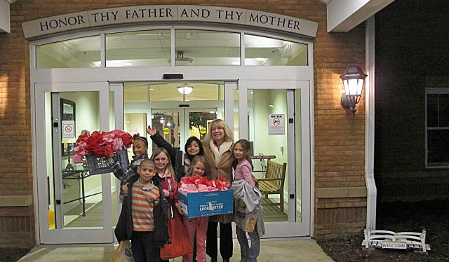 Monique Williams and the kids outside the Nursing Home