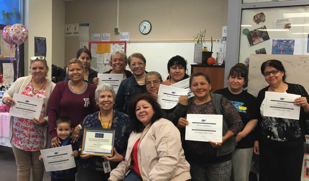 Happy House President Carol Loweree and ESL graduates